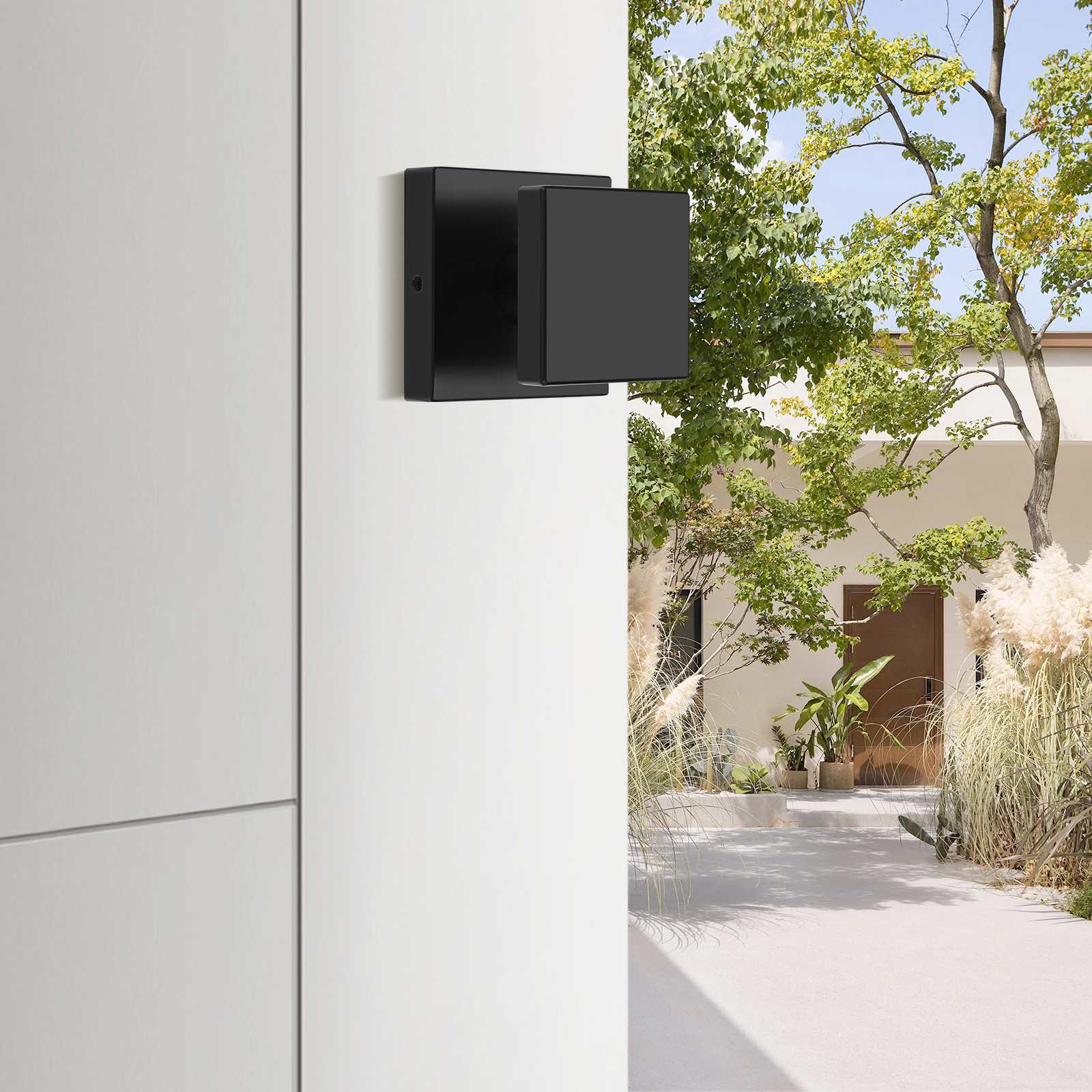 Contemporary entry door handle with square knob and secure deadbolt